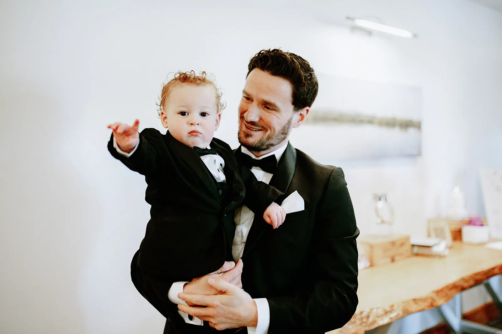 Quantock Lakes Wedding Venue groom holding baby