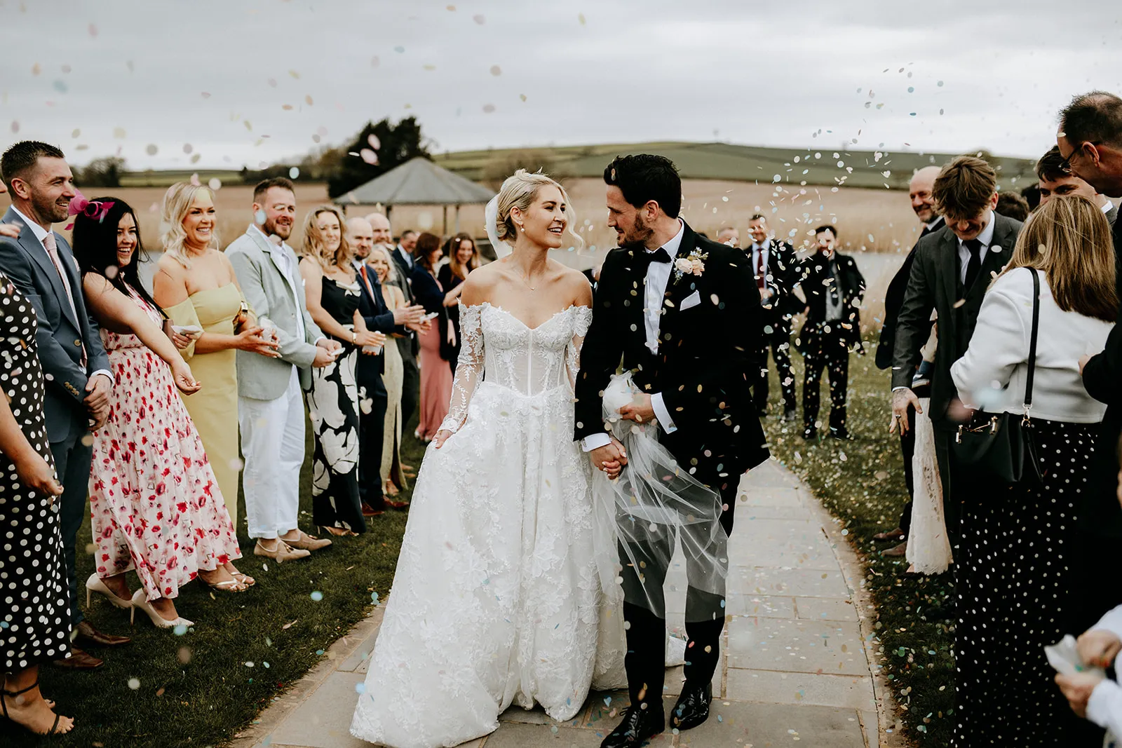 Quantock Lakes Wedding Venue confetti kiss moment