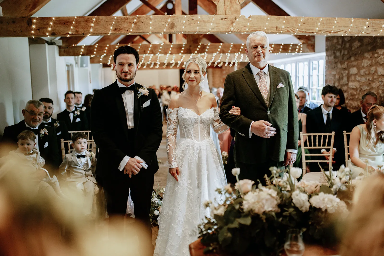 Quantock Lakes Wedding Venue bride walks down aisle