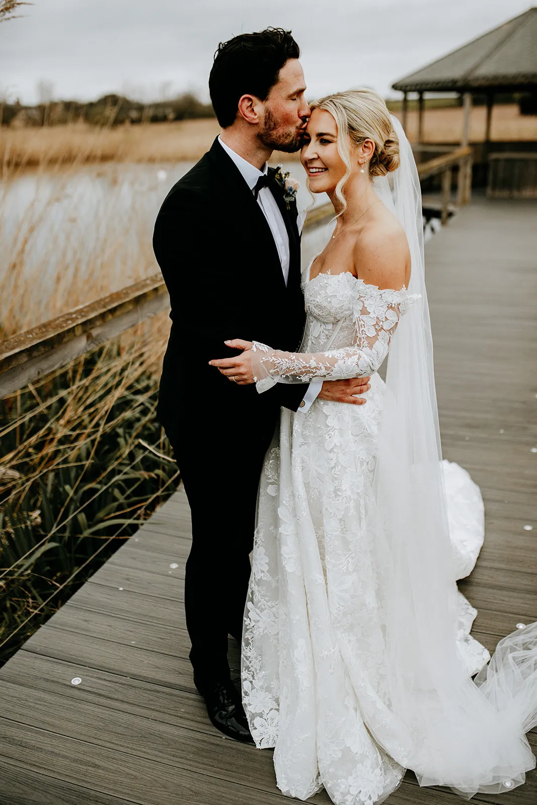 Quantock Lakes Wedding Venue couple embracing laughing